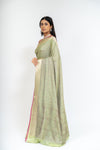 Wrapped In Elegance Pista Banarasi Silk Saree With Unstitched Blouse