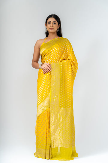 Shine Bright In Mango Gold Khaddi Georgette Saree With Unstitched Blouse