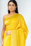 Shine Bright In Mango Gold Khaddi Georgette Saree With Unstitched Blouse