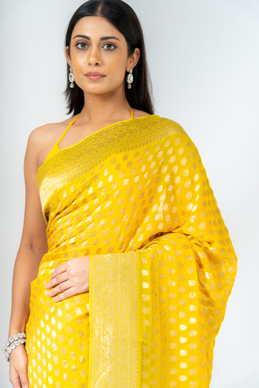 Shine Bright In Mango Gold Khaddi Georgette Saree With Unstitched Blouse