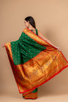 Regal Charm Bottle Green Banarasi Silk Saree With Unstitched Blouse