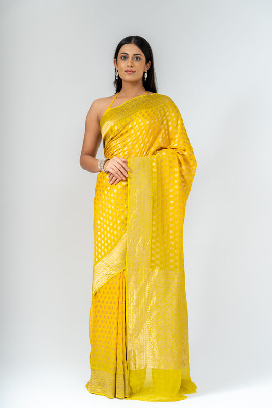 Shine Bright In Mango Gold Khaddi Georgette Saree With Unstitched Blouse