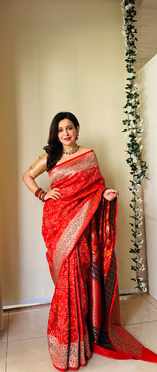 Grace Redefined Red Bandhani Gharchola Zari Border Banarasi Silk Saree With Unstitched Blouse (Ft:-Anjan Prasad)