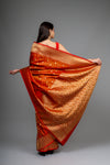 Rust Woven Zari Banarasi Silk Saree With Unstitched Blouse