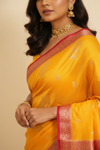Shine Bright In Mango Gold Banarasi Silk Saree With Unstitched Blouse