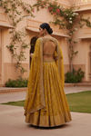 Mustard Georgette Lehenga Set And Net Dupatta With Readymade Blouse