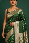 Regal Charm Bottle Green Banarasi Silk Saree With Unstitched Blouse