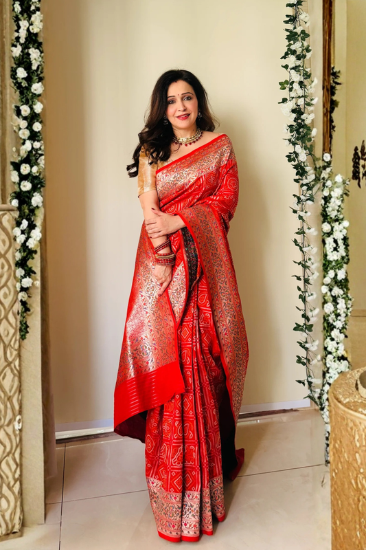 Grace Redefined Red Bandhani Gharchola Zari Border Banarasi Silk Saree With Unstitched Blouse (Ft:-Anjan Prasad)